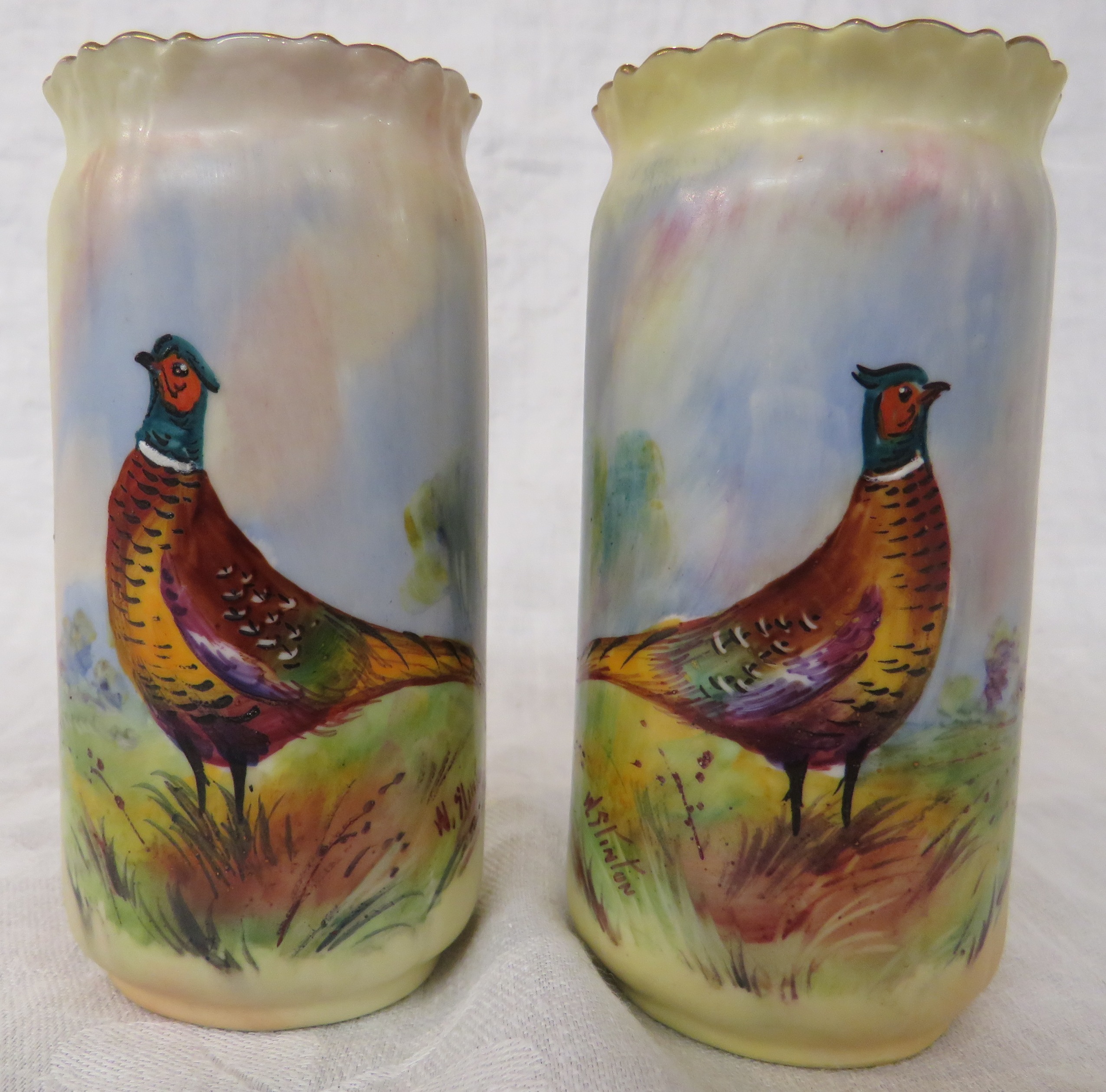 Pair of Locke & Co Worcester porcelain cylindrical spill vases, crepe rims with gilding, blush