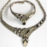 White metal Art Deco style necklace and matching bracelet, set as stylized leaves with mother of