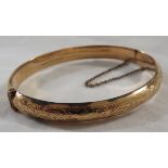 9 carat gold bangle, half chased, stamped 9 .375, safety chain, 7.4g