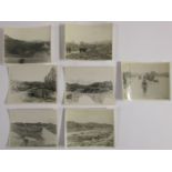 Six photographs showing atomic bomb damage at Nagasaki and Hiroshima with handwritten notes on