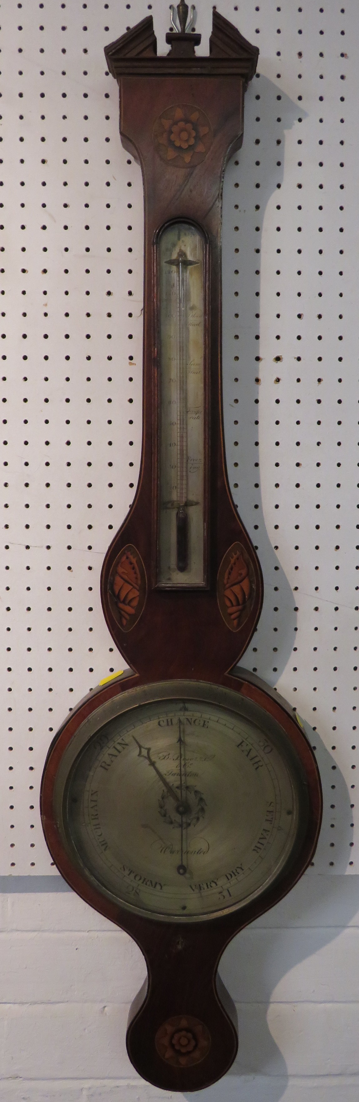 A banjo barometer with silvered dial signed B. Besorrio & Co Taunton Warranted, the thermometer