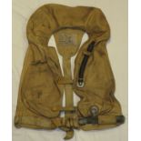 A WWII German life jacket / Schwimmweste with mouth inflator and canister inflator, manufactured