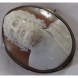 Cameo brooch depicting robed Roman male head and shoulders, oak leaves in hair, robe on his left