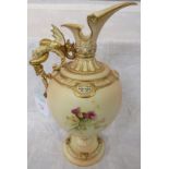 A large Royal Worcester blush ivory porcelain ewer, the body painted with thistles and flowers