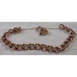 9ct gold hollow link bracelet with heart-shape clasp and safety chain, the clasp bearing British