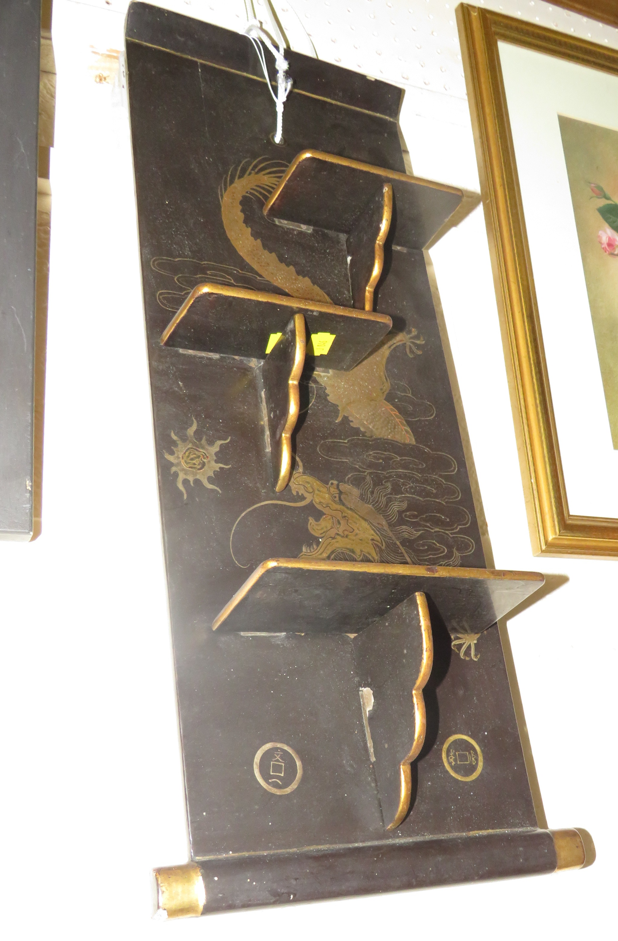 A WALL-HANGING BRACKET WITH THREE FOLDING SHELVES, BLACK LACQUER WITH GILT AND ENAMEL CHINESE DRAGON - Image 3 of 3