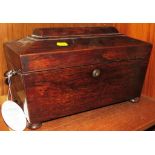 A large 19th century mahogany and rosewood sarcophagus tea caddy, the interior with velvet lined