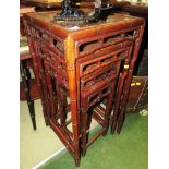 FOUR NESTING ORIENTAL STYLE WOODEN OCCASIONAL TABLES, THE LEGS AND SUPPORTS CARVED AS BAMBOO