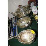 BARKER BROTHERS SILVER THREE PART TEA SET OF FACETED OVAL SHAPE, COMPRISING TEAPOT WITH WOODEN