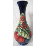 Moorcroft pottery bottle vase, graduated blue ground, tube lined decoration of plums and red