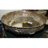 LARGE WHITE METAL BOWL WITH REPOUSSE FOLIAGE STANDING ON FOUR PIERCED FEET, STAMPED 830 (29 OZT)