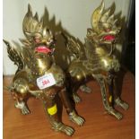 PAIR OF BRASS BUDDHISTIC STYLE LIONS (HEIGHT 23CM)