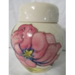 Moorcroft pottery lidded jar, cream ground, tube lined decoration of pink magnolia flowering branch,