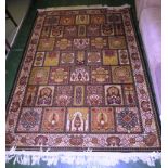 BLACK AND GOLD GROUND PATTERNED FLOOR RUG WITH TASSELED ENDS