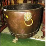 LARGE COPPER RIVETED PLANTER OR TUB STANDING ON PAW FEET WITH LIONS MASK HANDLES