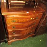 A REPRODUCTION WALNUT VENEERED BOW FRONTED CHEST OF FOUR DRAWERS WITH BRUSH SLIDE AND METAL HANDLES