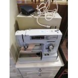 TOYOTA 2000 ELECTRIC SEWING MACHINE WITH PLASTIC CARRY CASE