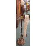 A standard wool skein winder, mahogany column on turned circular foot, gilt brass mountings for