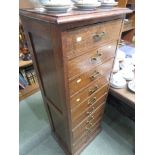 EARLY 20TH CENTURY OAK BANK OF TEN DRAWERS WITH BRASS HANDLES, HEIGHT 130CM, WIDTH 50CM, DEPTH 38CM