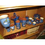 SHELF OF DECORATIVE BLUE COLOURED TORQUAY POTTERY WARE