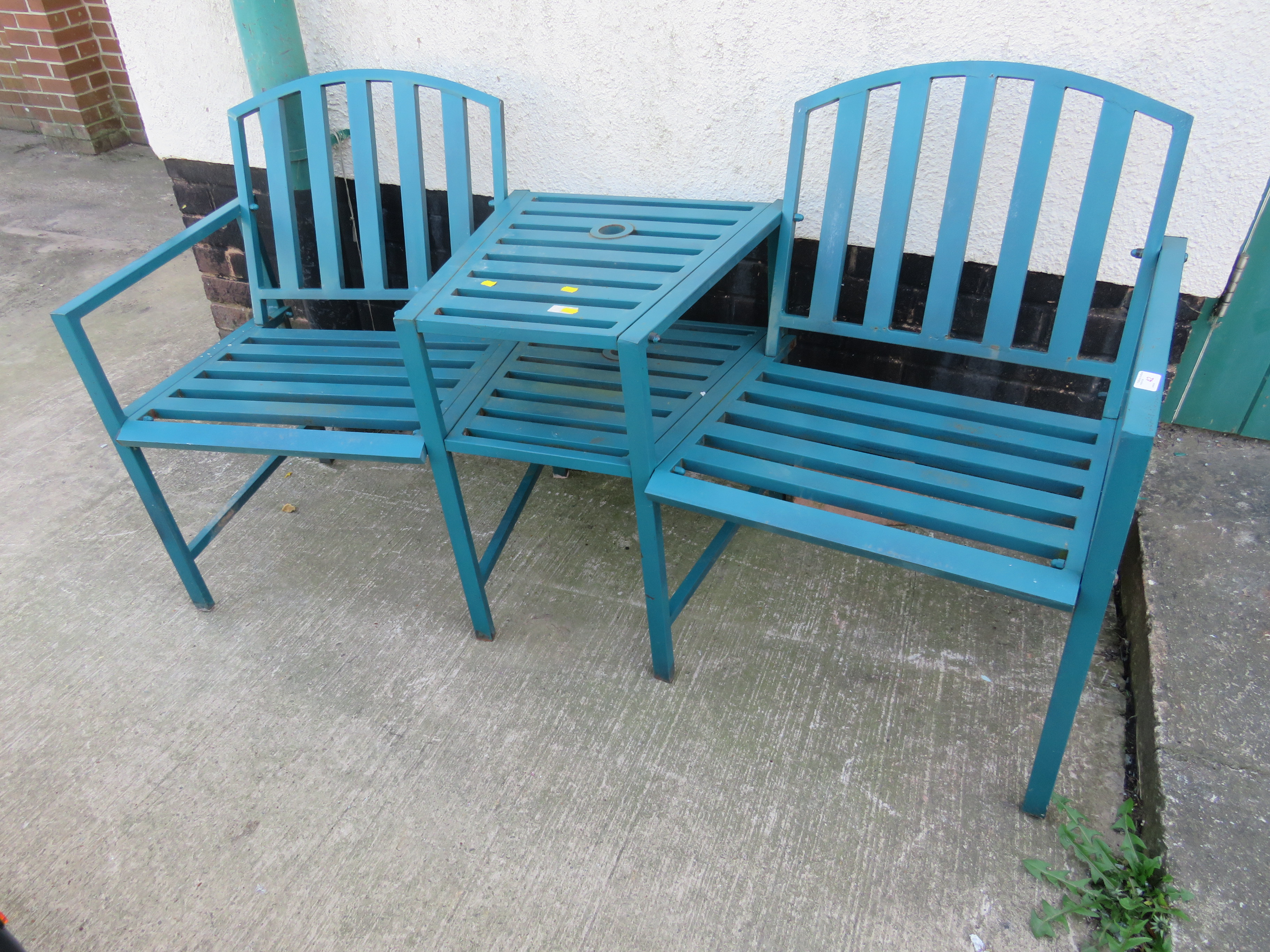 GREEN PAINTED METAL TWIN GARDEN SEAT WITH ADJOINING CENTRAL TABLE