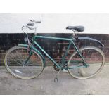 GREEN RALEIGH GENTS BIKE WITH MUD AND CHAIN GUARDS, KICK STAND AND LIGHT
