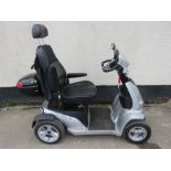 RASCAL VISION FOUR WHEELED MOBILITY SCOOTER WITH LEATHER SEAT AND HEADREST, LIGHTS, REAR PANNIER