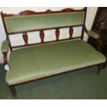 A small Edwardian settee with a slender mahogany and rosewood veneer frame with boxwood inlay and