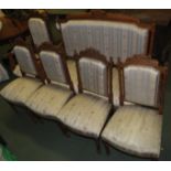 A late 19th century mahogany framed drawing room suite comprising two-seater settee, armchair, and