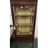 A narrow mahogany china display cabinet with glazed sides, a single door with geometric glazing,