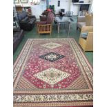 LARGE RECTANGULAR RED AND CREAM GROUND PATTERNED FLOOR RUG (APPROXIMATE SIZE 235 X 310 CMS)