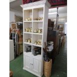 CREAM PAINTED WOODEN SHELF UNIT WITH TWO DOORS TO BASE