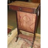 A 19th century mahogany prayer stand with single drawer, brass page retainers, light red upholstery,