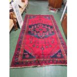 FOUR MARGIN RECTANGULAR RED GROUND PATTERNED FLOOR RUG (APPROXIMATE SIZE 150CM X 250CM)