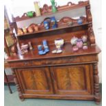 A large mahogany Victorian serving sideboard with tall carved backboard and two shelves on