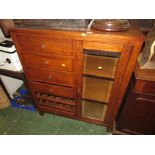 STAINED OAK VENEERED UNIT WITH FIVE DRAWERS, OPEN SHELVES AND GLAZED DOOR