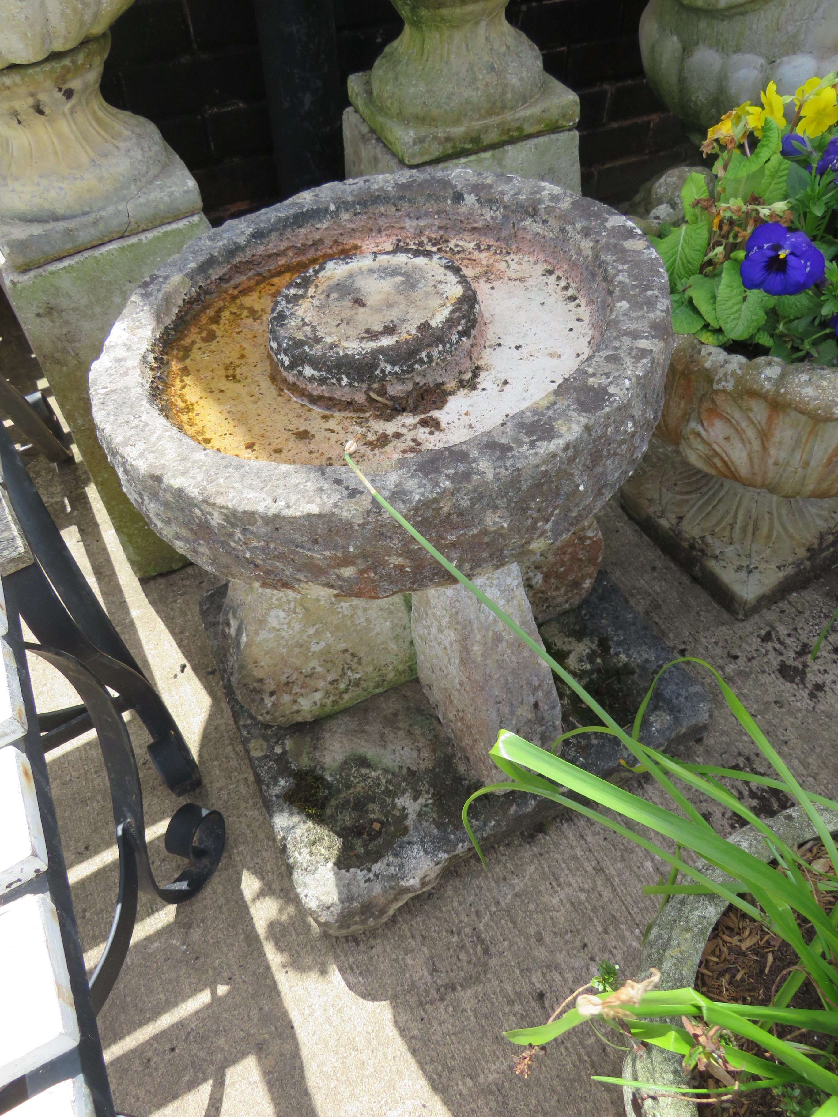 CIRCULAR BIRDBATH STANDING ON CROSS COLUMN AND STONE PLINTH WITH SMALL BOWL INDENTATIONS TO EACH