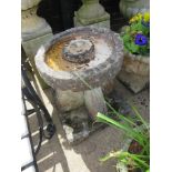 CIRCULAR BIRDBATH STANDING ON CROSS COLUMN AND STONE PLINTH WITH SMALL BOWL INDENTATIONS TO EACH