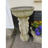 DEEP BIRDBATH STANDING ON COLUMN OF NUDE FEMALE FIGURES