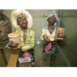 TWO POTTERY FIGURAL BUSTS OF BLACK MAN AND WOMAN WITH BASKETS, IMPRESSED MARKS TO BASE