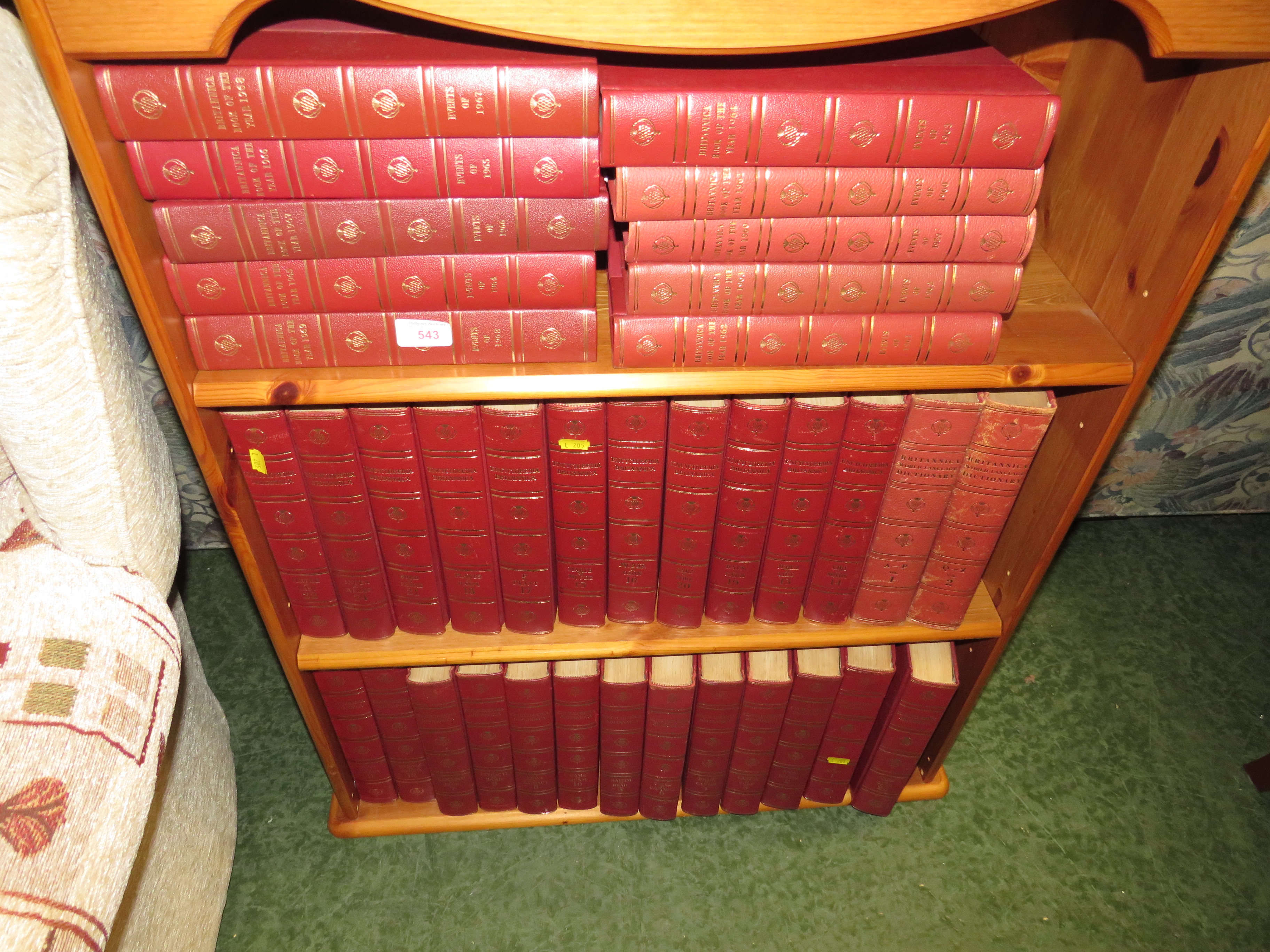 THREE SHELVES OF ENCYCLOPAEDIA BRITANNICA AND BRITANNICA BOOK OF THE YEAR EDITIONS