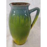 CH Brannam for Liberty & Co narrow ovoid jug in blue, green and yellow graduated glaze, height 18cm,