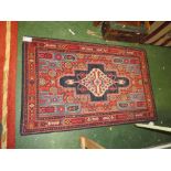 SMALL RED GROUND PATTERNED FLOOR RUG WITH CENTRAL MEDALLION