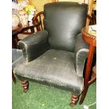 VINTAGE DARK LEATHER UPHOLSTERED ARMCHAIR STANDING ON TURNED FRONT LEGS AND CHINA CASTORS