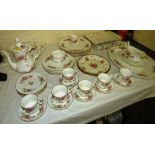 ROYAL ALBERT 'MOSS ROSE' PART DINNER AND TEA SERVICE INCLUDING GRAVY BOAT, CUPS AND SAUCERS, AND