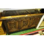 OAK COFFER WITH CARVED FRONT AND PANELLING