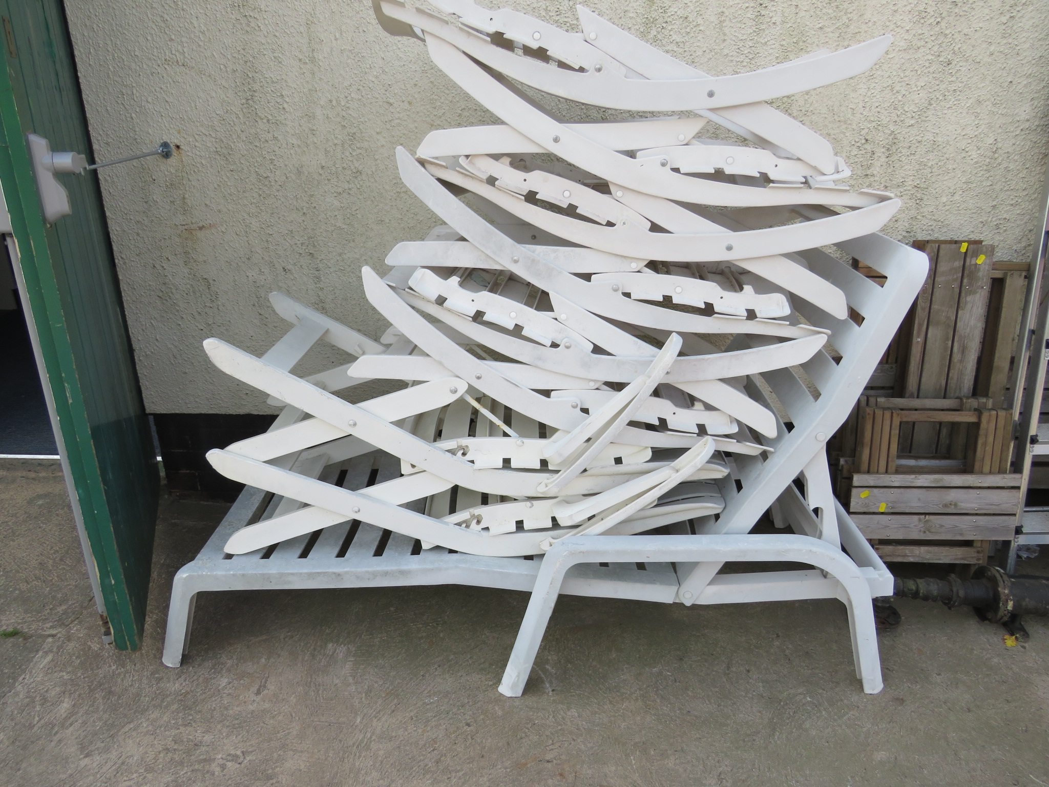 WHITE PLASTIC SUN LOUNGER AND EIGHT FOLDING GARDEN CHAIRS (SOME CUSHIONS INSIDE SALEROOM)