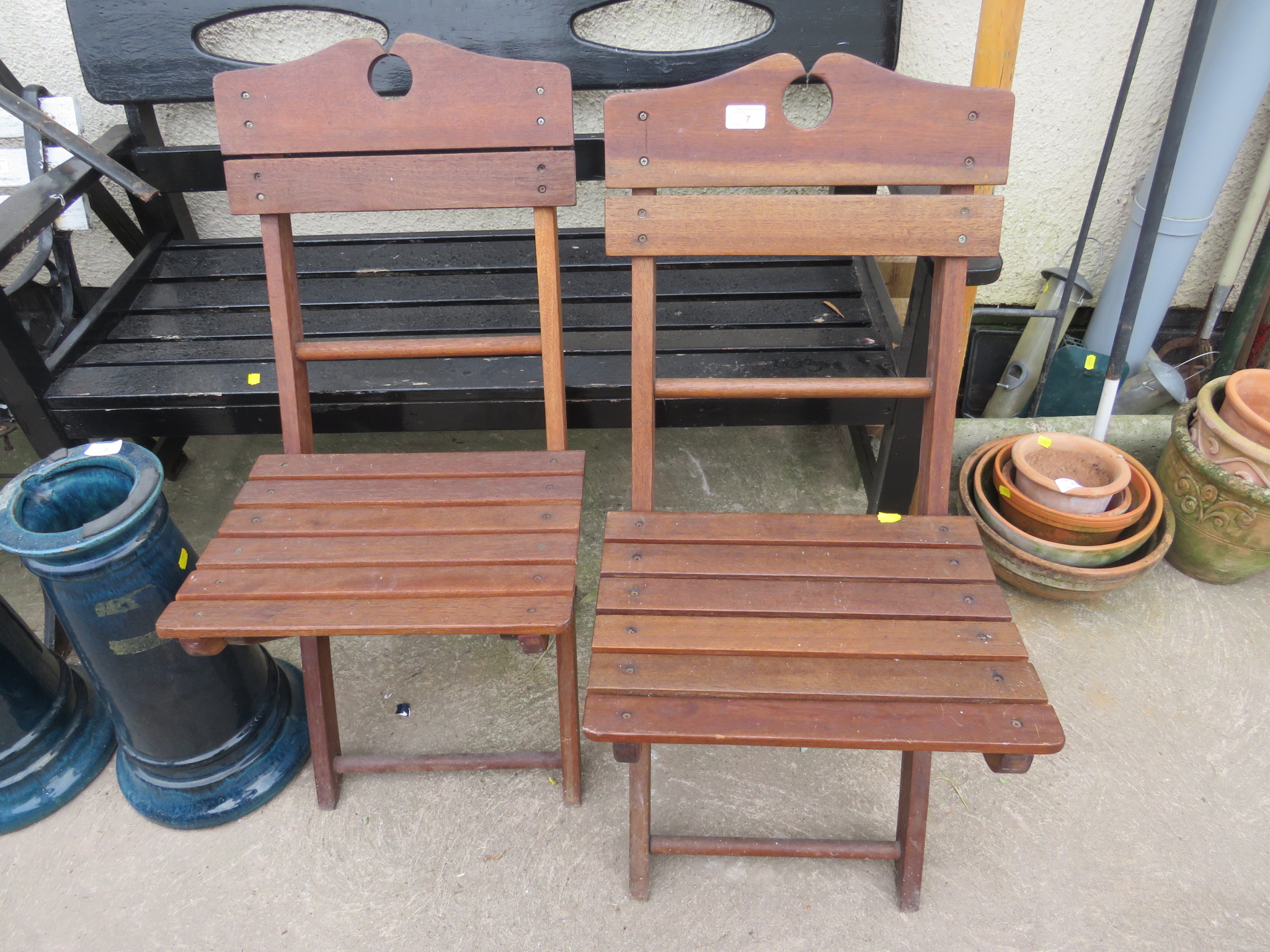 TWO WOODEN FOLDING GARDEN CHAIRS