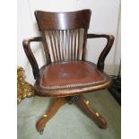 OAK FRAMED ADJUSTABLE SWIVEL ARMCHAIR / DESK CHAIR, ADJUSTMENT WHEEL MARKED 'W. A & CO LTD, MADE