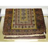 SMALL RECTANGULAR BROWN GROUND WOVEN WOOLLEN FLOOR RUG WITH FIVE MARGINS AND CENTRAL ROW OF